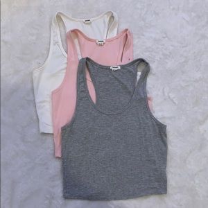 three different colors of garage racerback tops